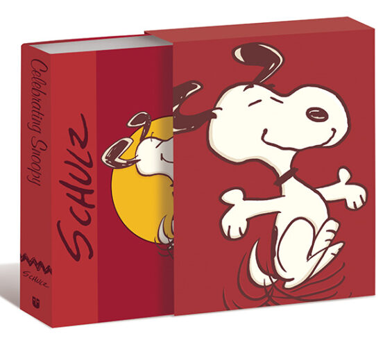 The cover of Celebrating Snoopy, a book celebrating Charles Schulz's iconic character.